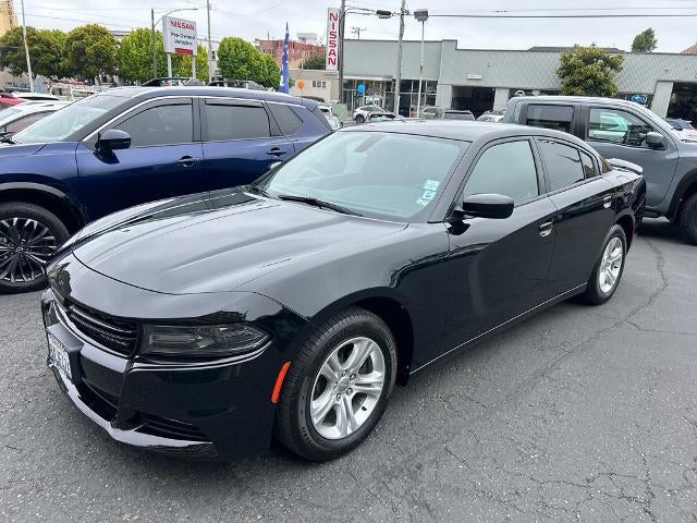 2021 Dodge Charger SXT RWD in Pitch Black Clearcoat — front three-quarter view