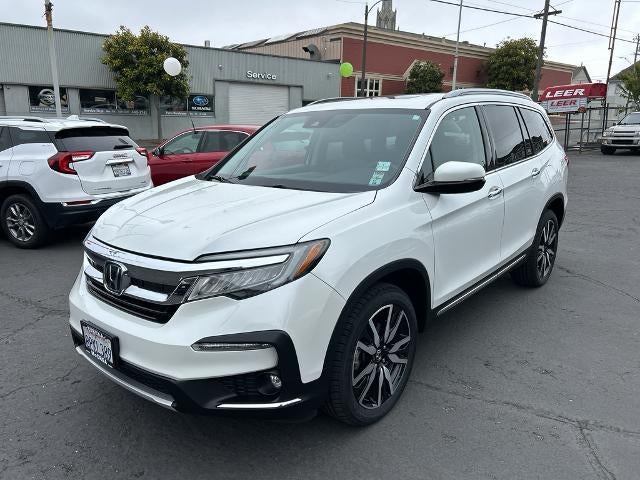 2020 Honda Pilot Touring 8-Passenger AWD in Platinum White Pearl — front three-quarter view